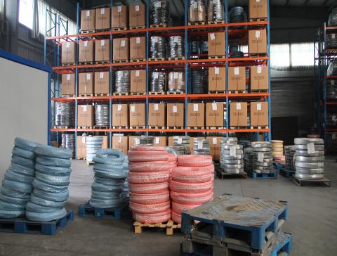 How should rubber drainage hoses be stored?