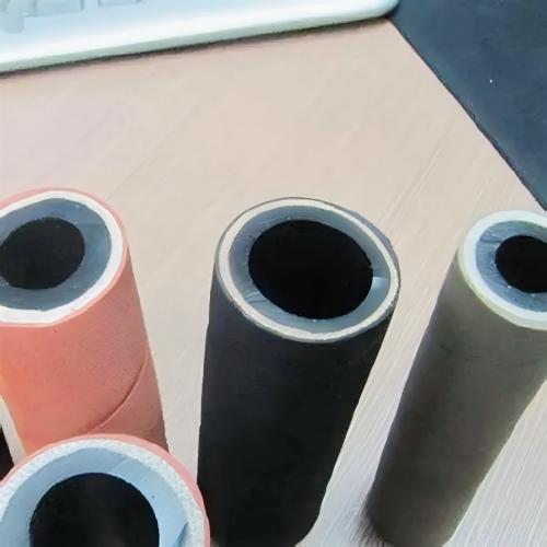 Large-diameter, highly corrosion-resistant chemical transfer hoses for chemical processing plants